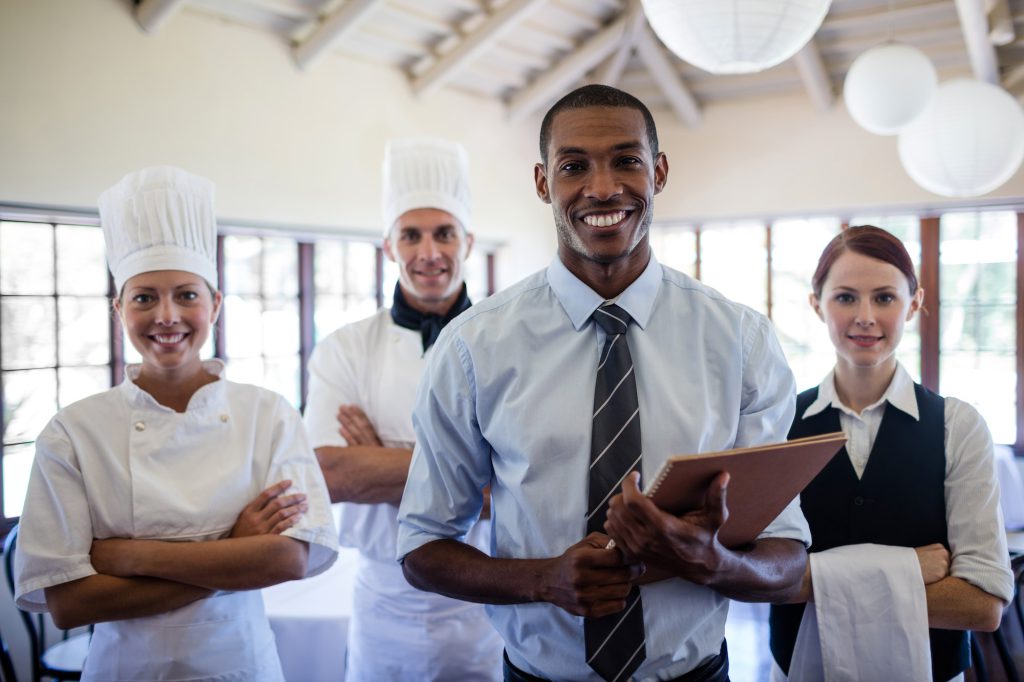 Group of hotel staffs standing in hotel
