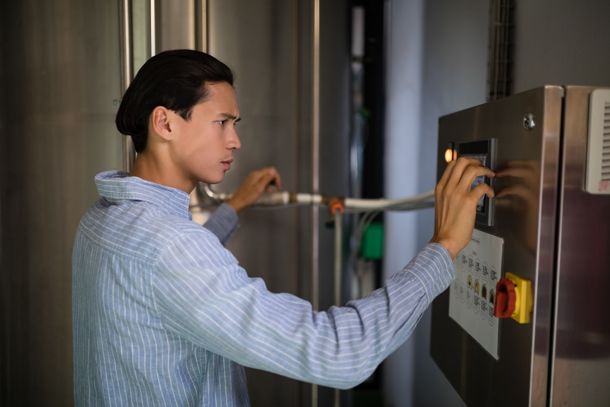 Manager operating machinery in warehouse